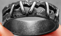 Stainless steel punk stitching style double ring in dark colour showing double band construction