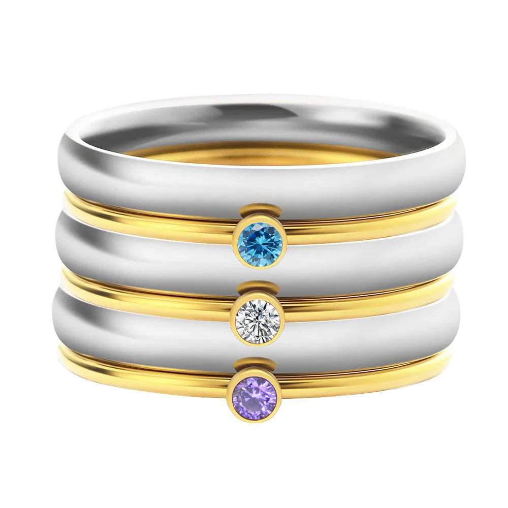 Titanium steel geometric ring with December birthstone colour and engraved pattern.