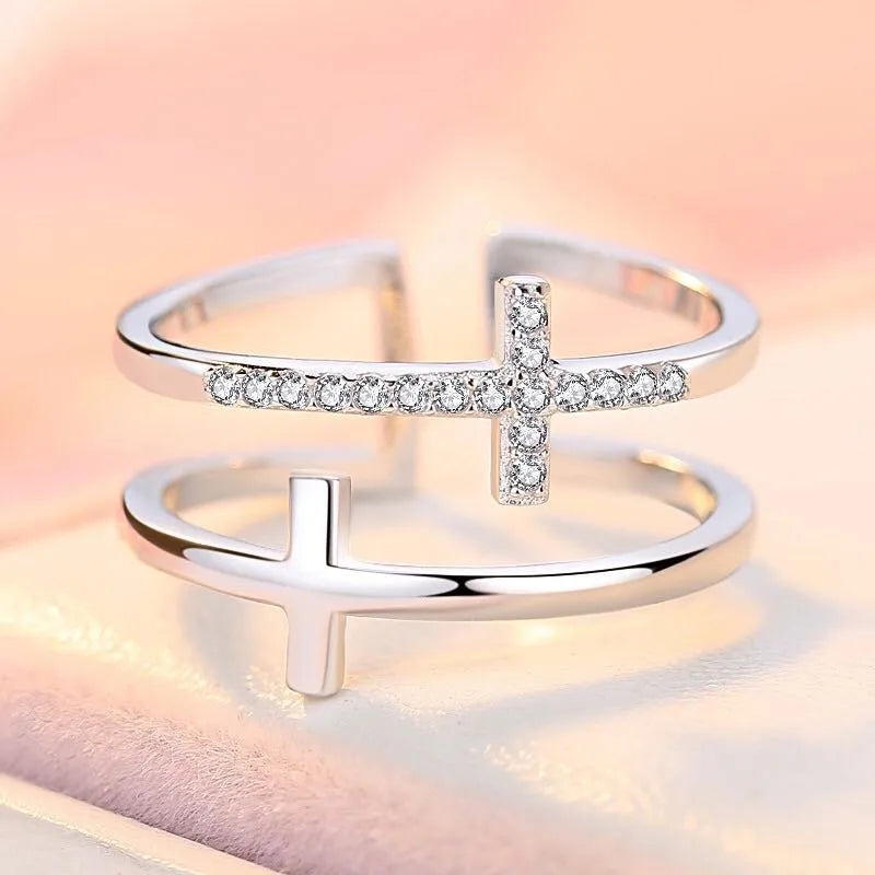 Women's adjustable copper ring with geometric double cross design and zircon stone inlay in silver setting