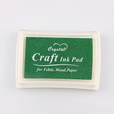 Set of 24 small bottles of cream cake and soap pigment colours with crafting tools like glitter and a sponge.