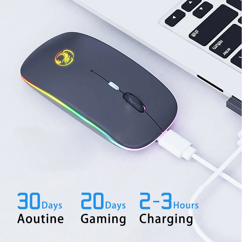 Black or white dual-mode wireless silent mouse with USB charging cable on desk