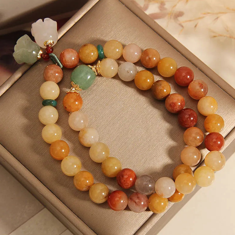 Natural green jade multi-layer wrap bracelet for women with a silver orchid pendant charm.