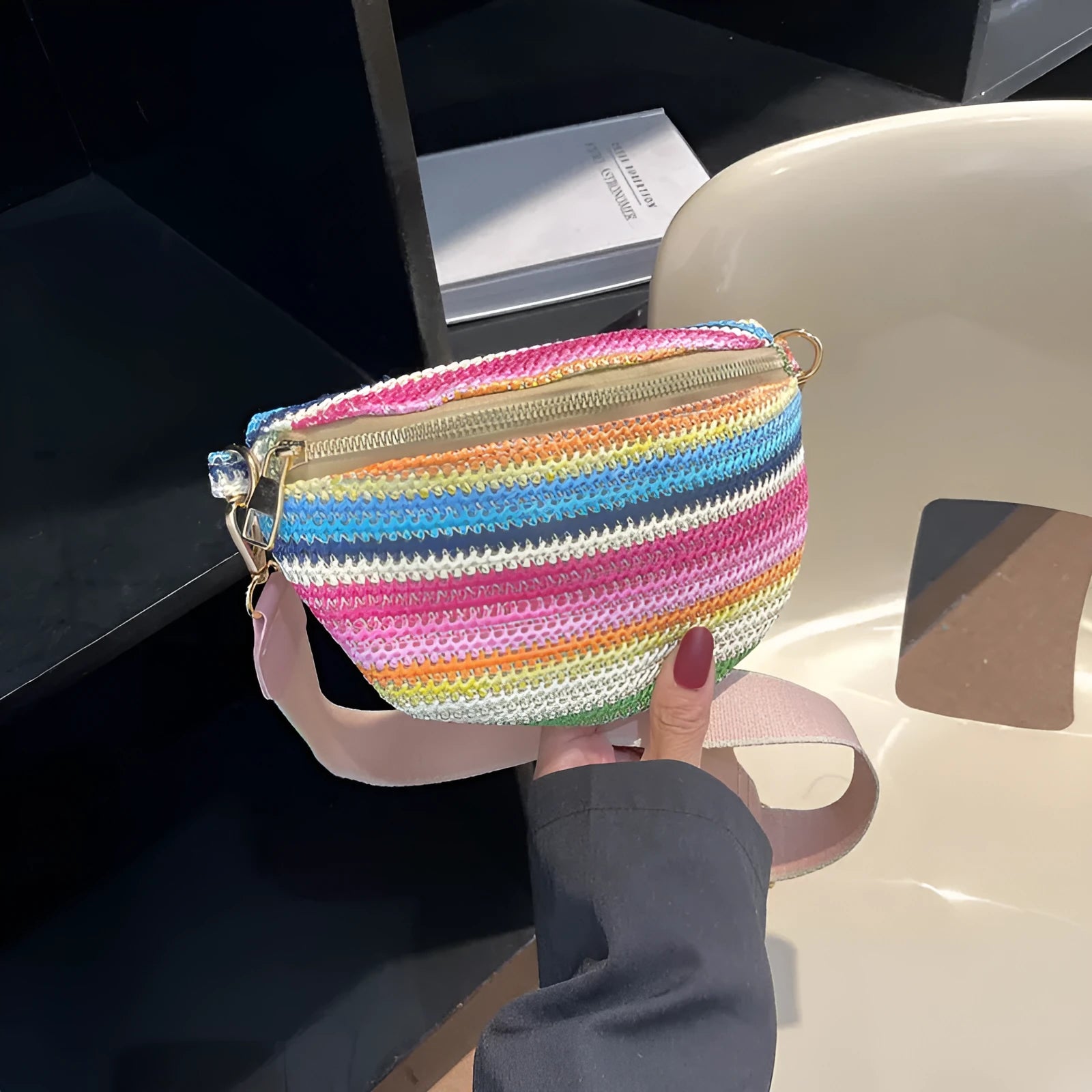 Women's straw woven beach bag with shell shape and single shoulder strap in pink colour option