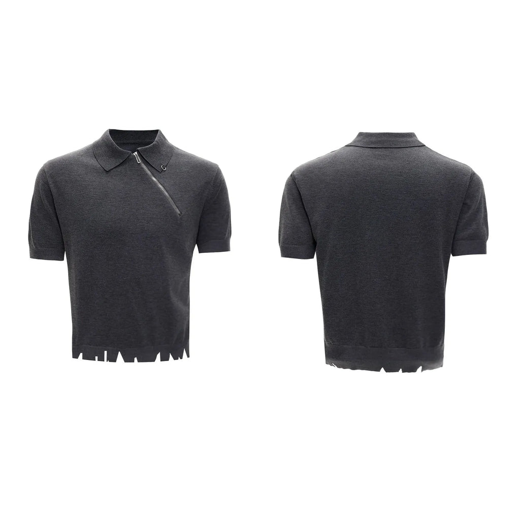 Man wearing a slim-fit black knitted polo shirt with a diagonal zip on the lapel collar.