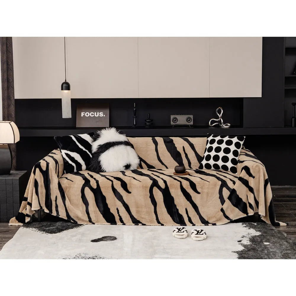 Zebra pattern flannel sofa cover with non-slip design shown on living room furniture