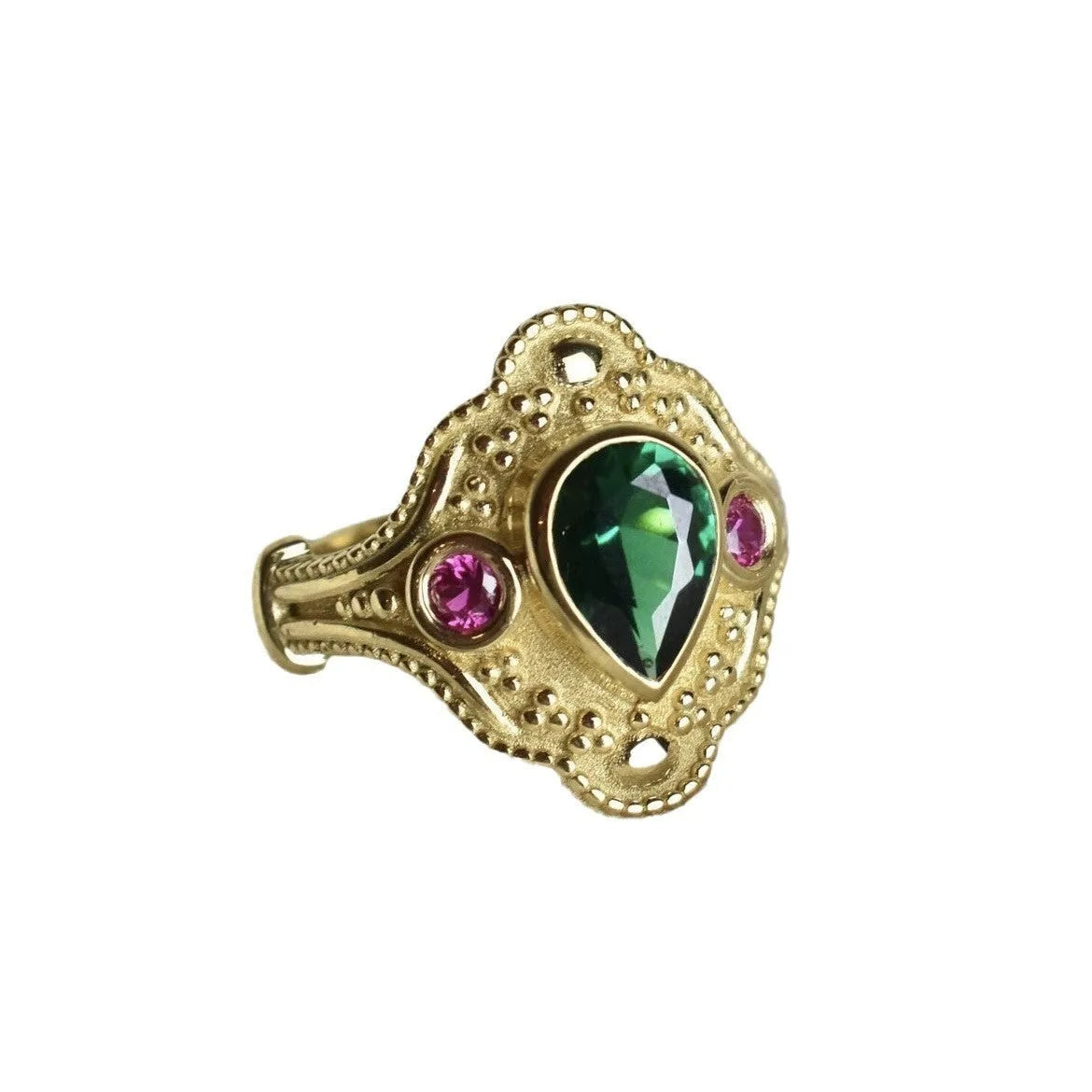 Geometric golden women's fashion ring on a grey background, showing its electroplated alloy construction.