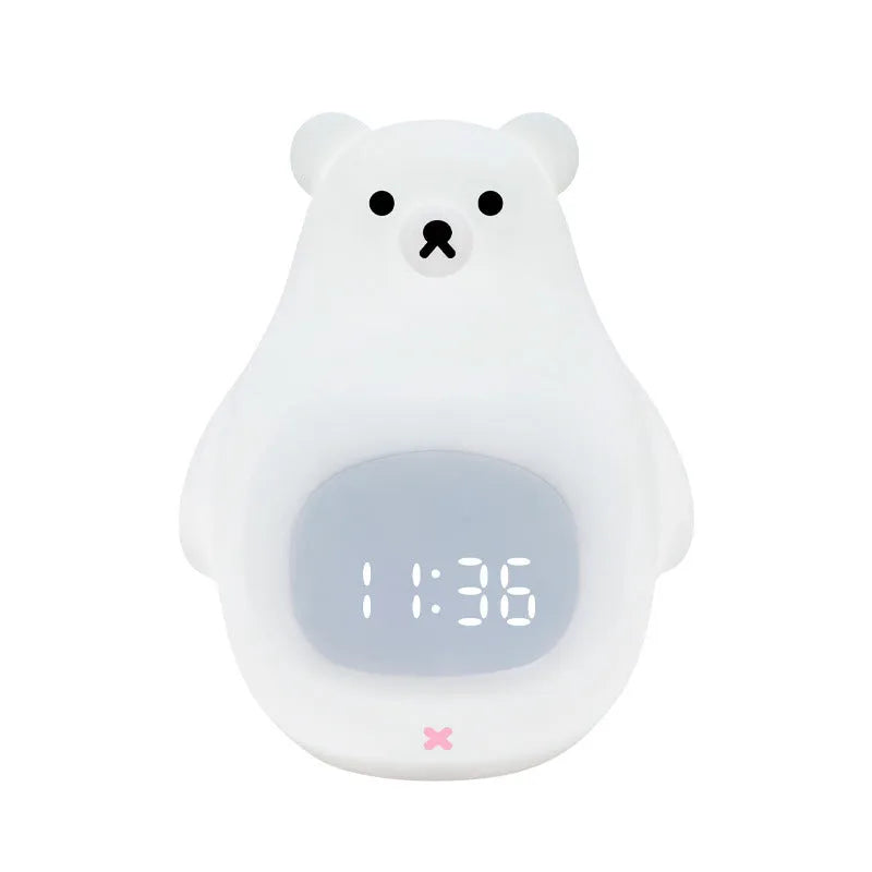 White bear-shaped silicone night light with remote control on a table.