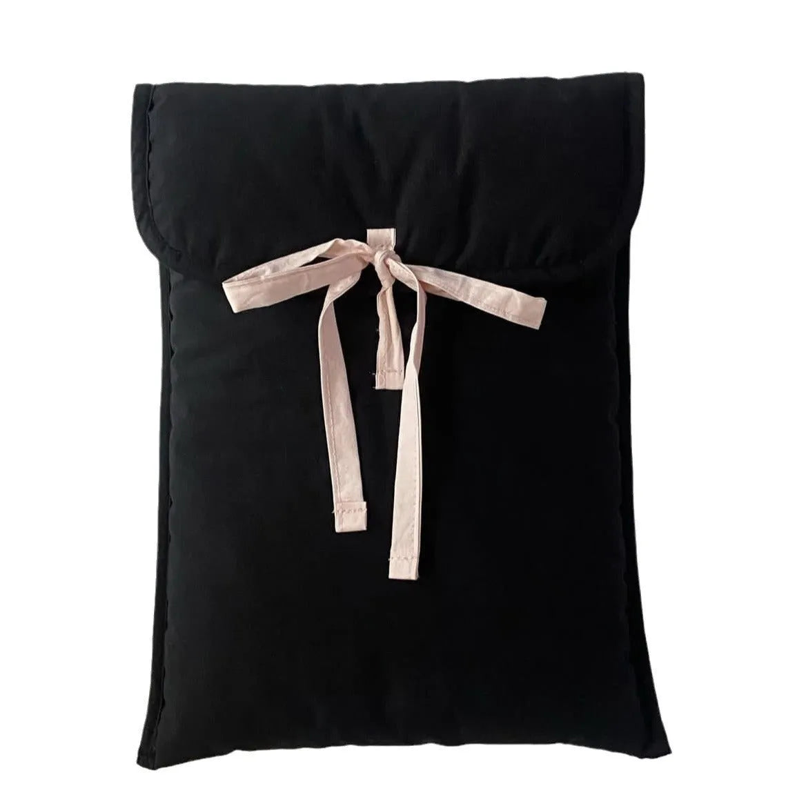 Women's black and white quilted nylon laptop bag with a ballet-style bow.