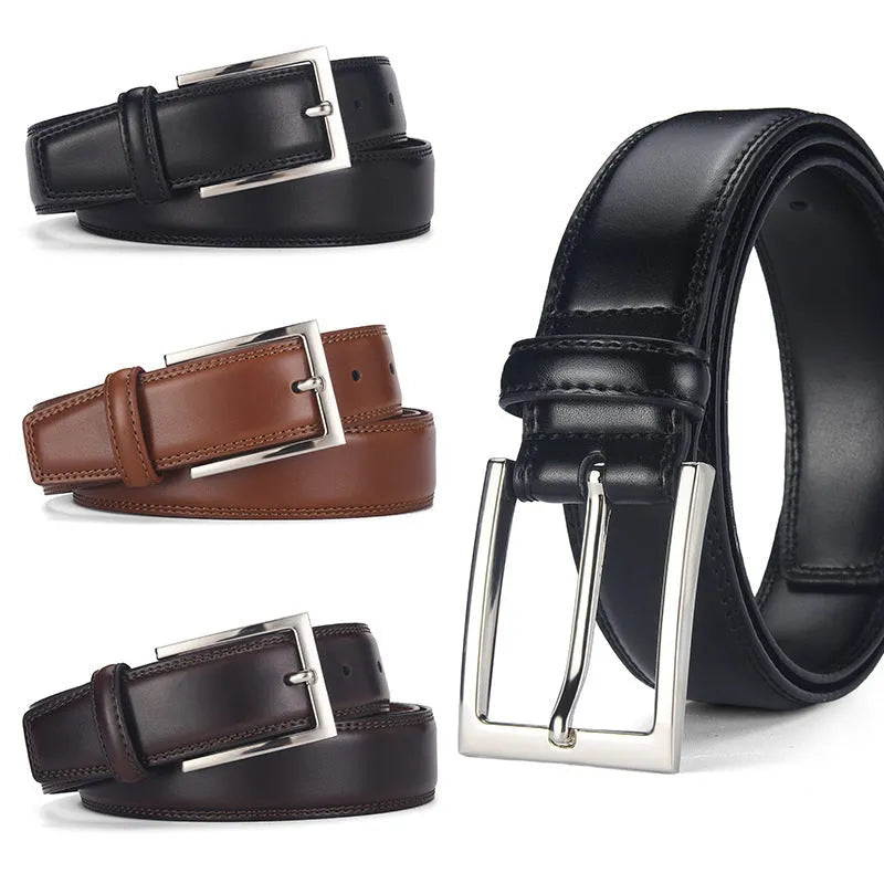 Men's classic black patent leather belt with a silver pin buckle on a flat surface.