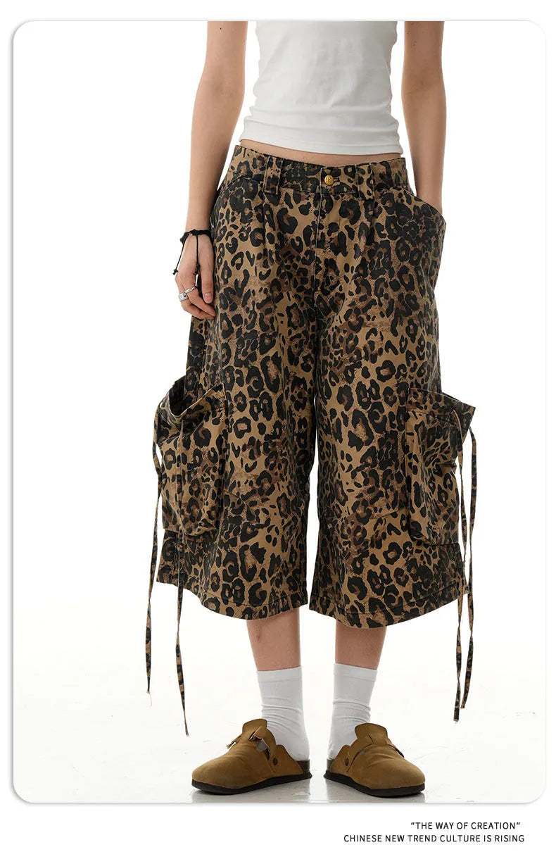 Leopard print high-waisted loose-fit cropped cotton trousers on a hanger