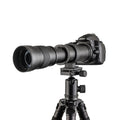 Manual telephoto zoom camera lens adapter with 420-800mm range and 67mm filter thread on a black background.