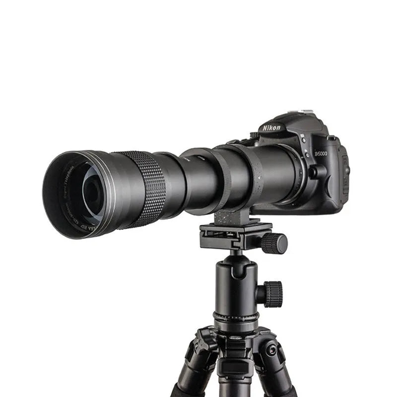Manual telephoto zoom camera lens adapter with 420-800mm range and 67mm filter thread on a black background.