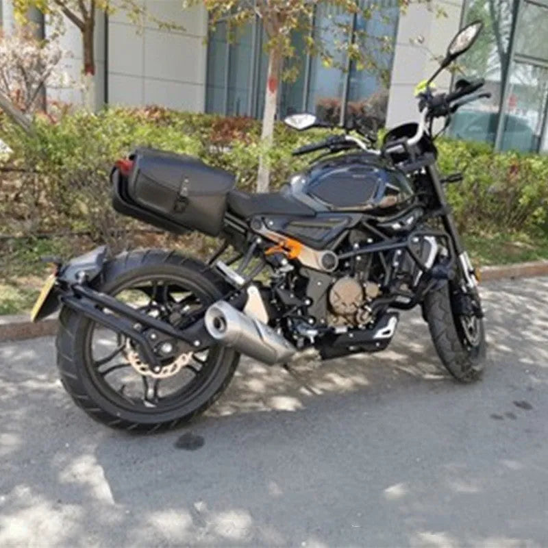Black PU leather motorcycle swingarm saddlebag mounted on a Harley Sportster, showing side storage compartment.