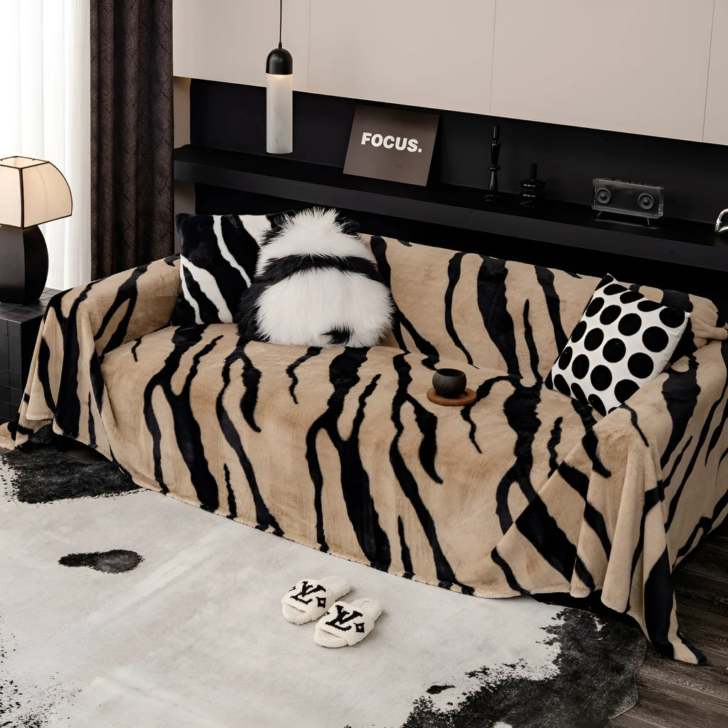 Zebra pattern flannel sofa cover with non-slip design shown on living room furniture