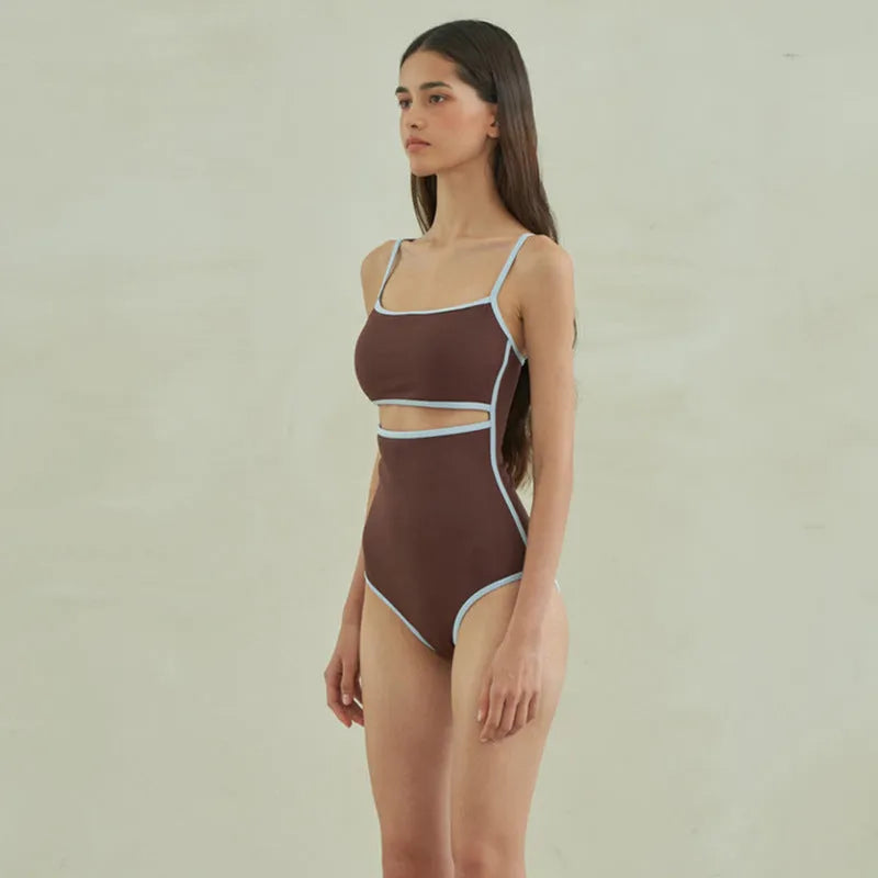 Brown women's triangle one-piece swimsuit on a hanger, sizes M L XL available.