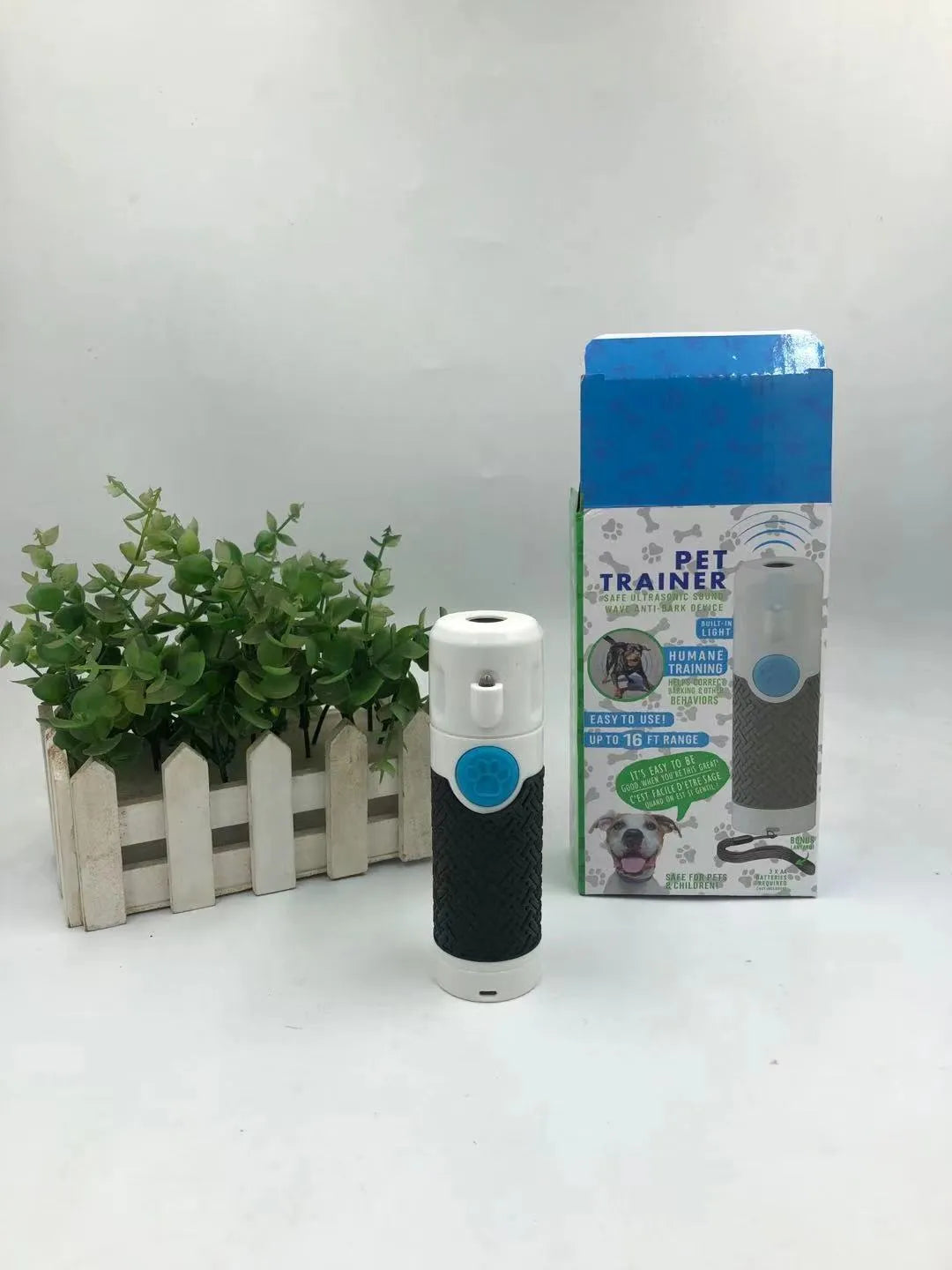 White handheld ultrasonic dog trainer device for bark control