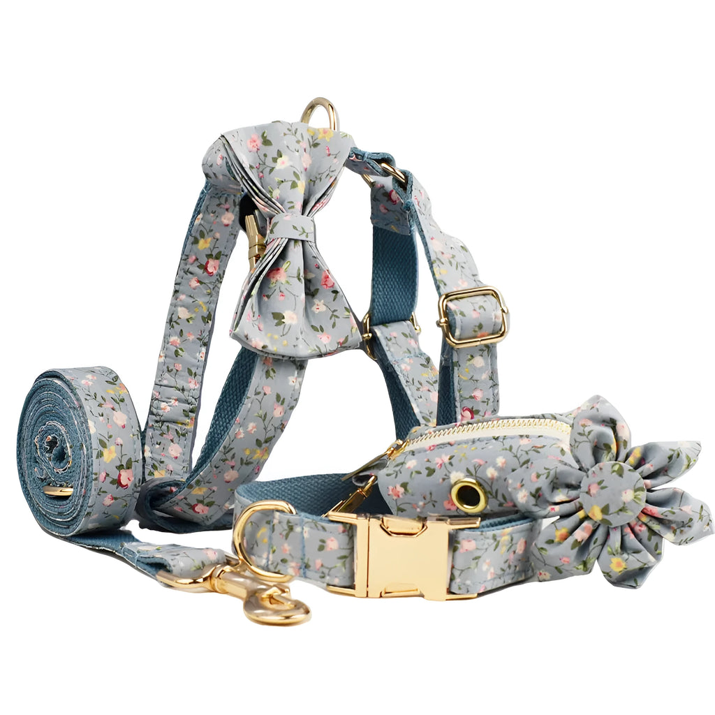 Blue floral patterned cloth dog collar set with matching leash, bow, and vest for small to extra-large dogs.