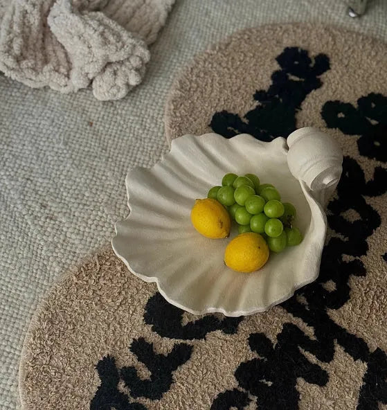 White resin fruit plate decoration with simulation shell design on table setting