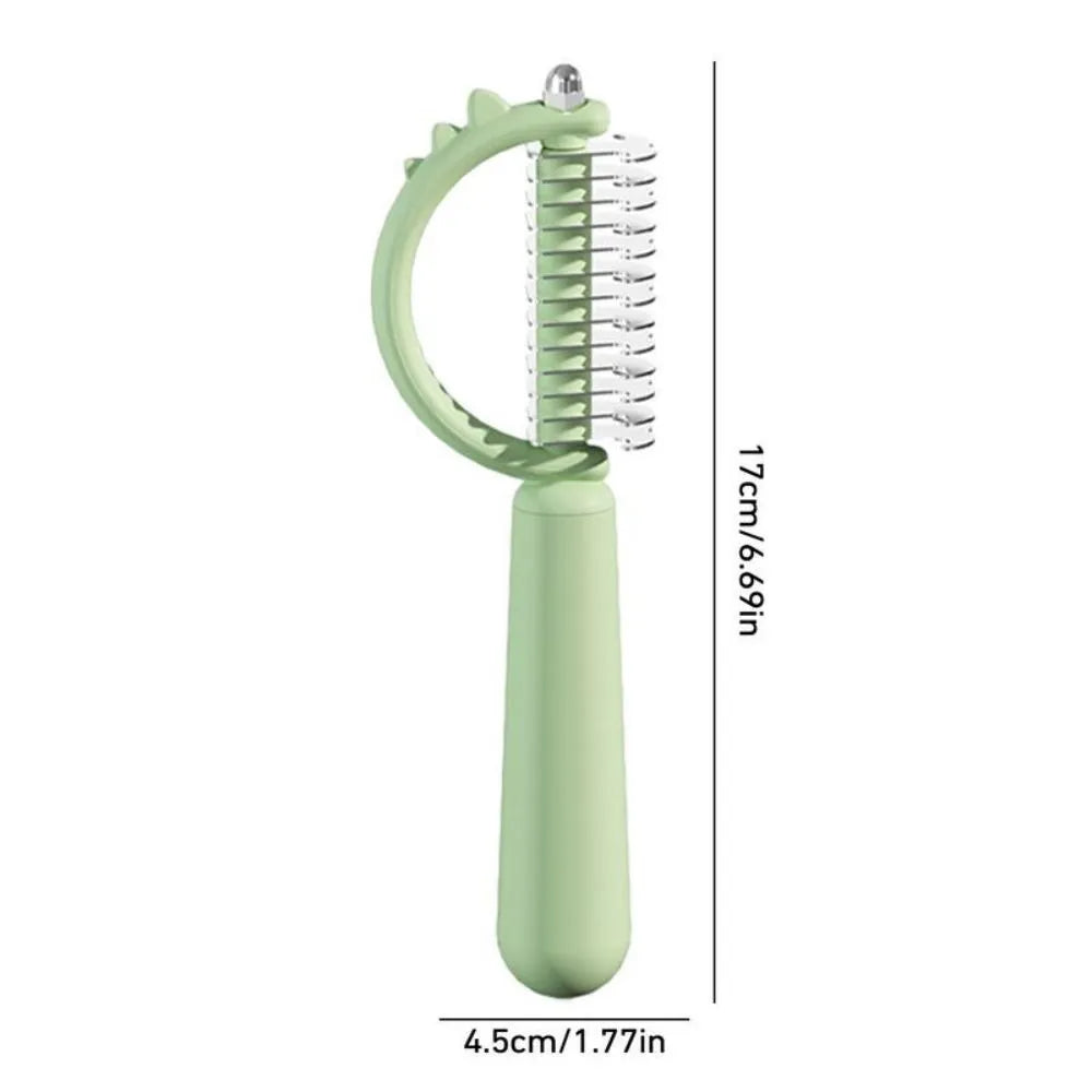 Dinosaur shaped cat brush with stainless steel bristles and self cleaning feature