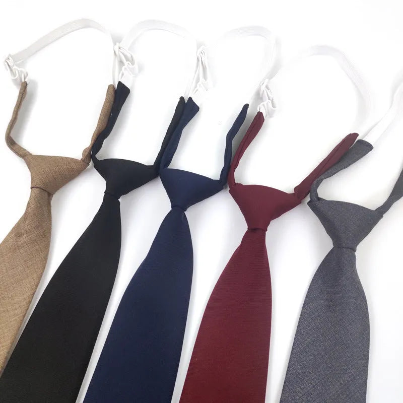 Men's solid colour cotton bow tie in arrow style, shown in navy blue.