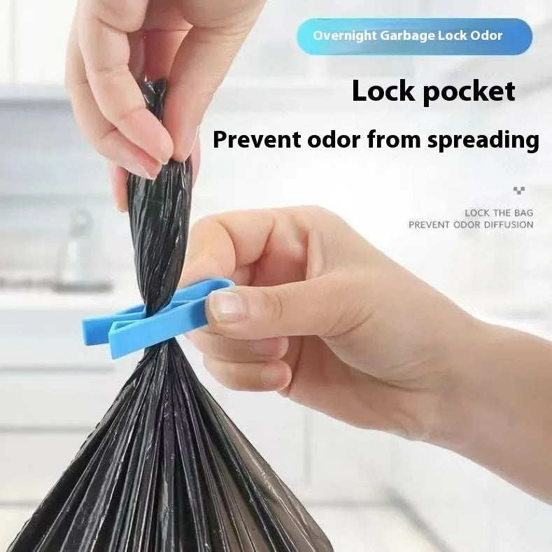 Transparent plastic non-slip clip for holding a garbage bag on the rim of a bin.