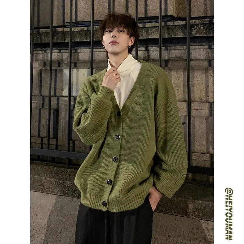 Army green men's V-neck knitted cardigan with long sleeves on a hanger