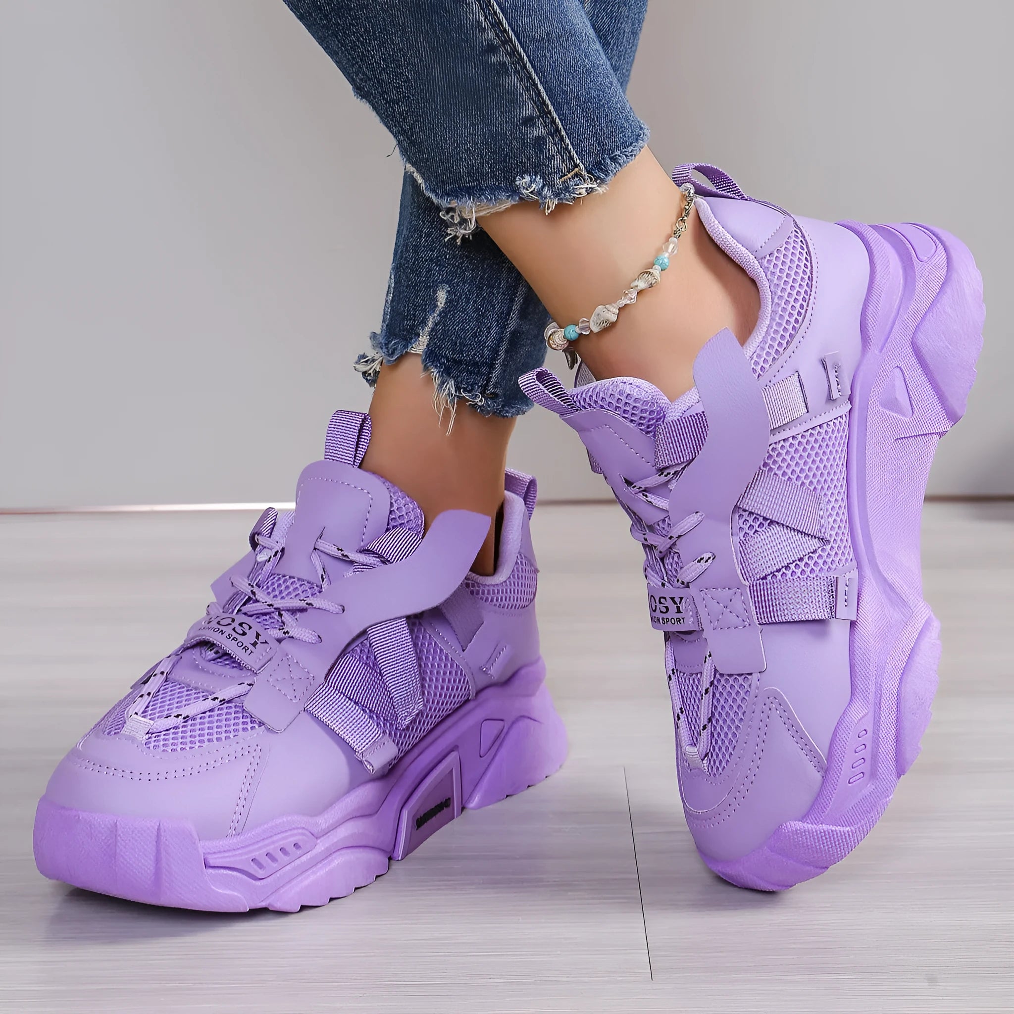 Women's purple mesh platform dad shoes with front lace-up design on a plain background.