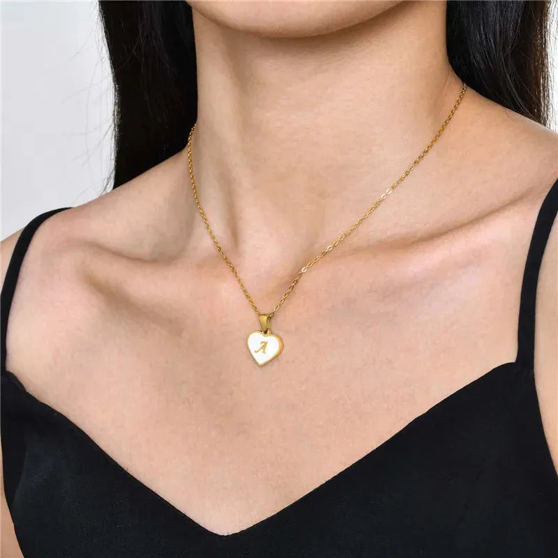 Gold plated heart necklace with white shell centre on a 45+5cm chain