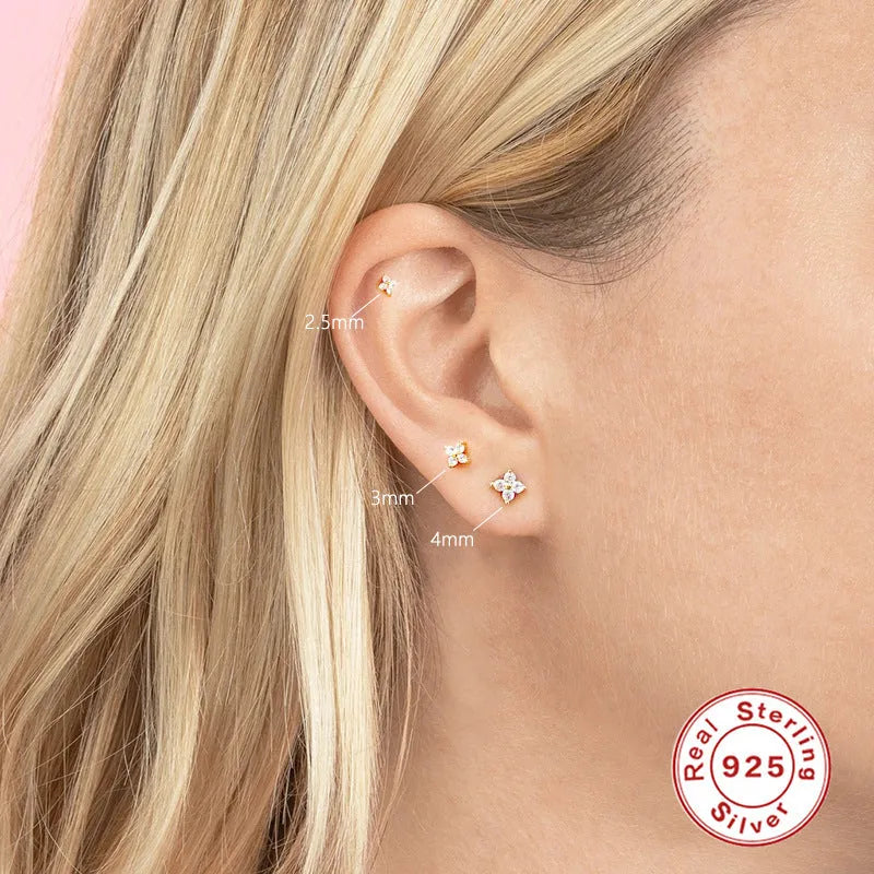 S925 sterling silver petal crystal flower stud earrings in gold finish on a white background.