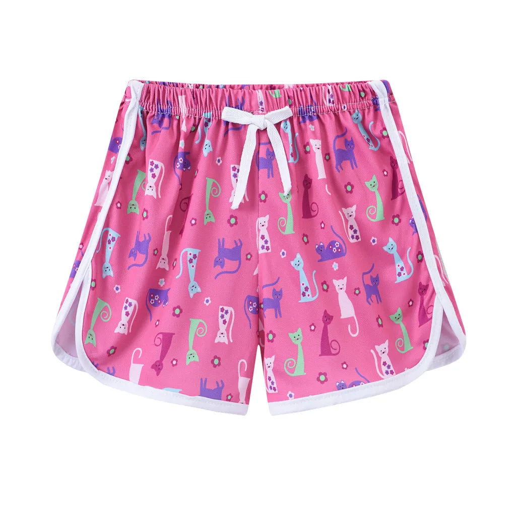 Children's casual beach shorts in polyester with multiple colour and pattern options for holiday wear