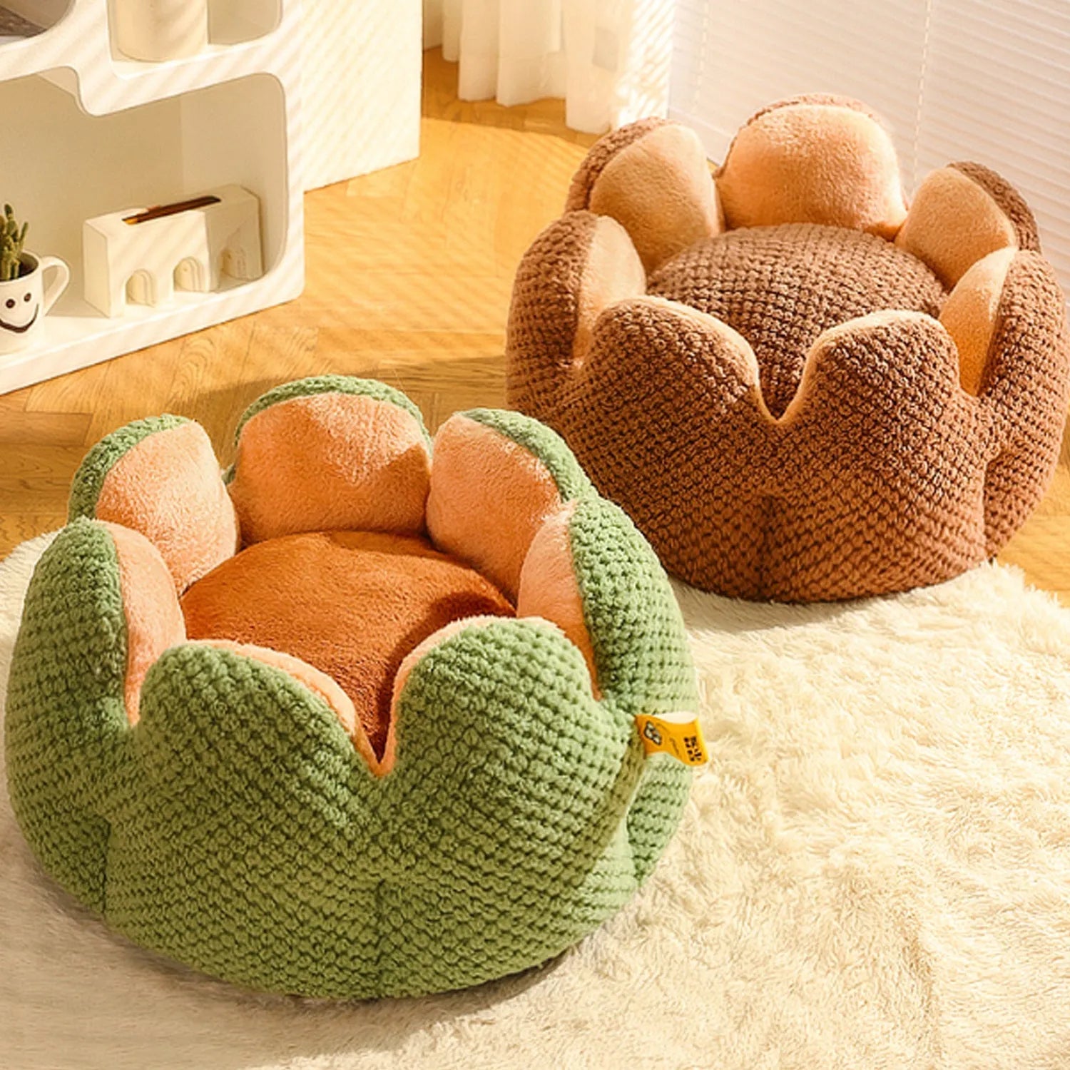 Green cactus petal shaped enclosed pet bed for cats and dogs on a hardwood floor.
