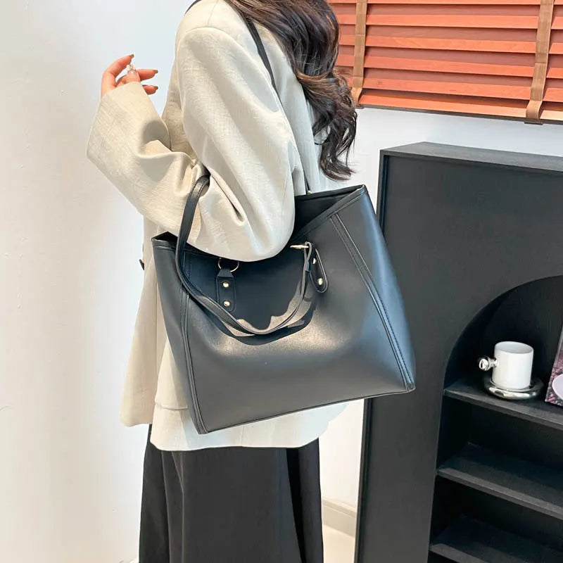 Korean-style black PU leather horizontal square shoulder underarm bag with an outer sandwich pocket.