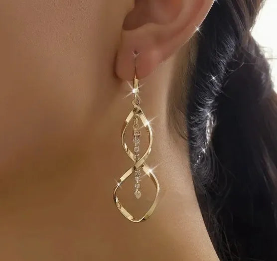 Gold geometric spiral design earrings with oval diamond shape for women