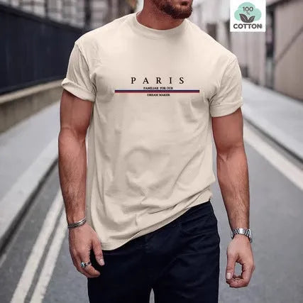 Man wearing a loose-fit short-sleeved t-shirt with a large letter print on the chest in a solid colour.