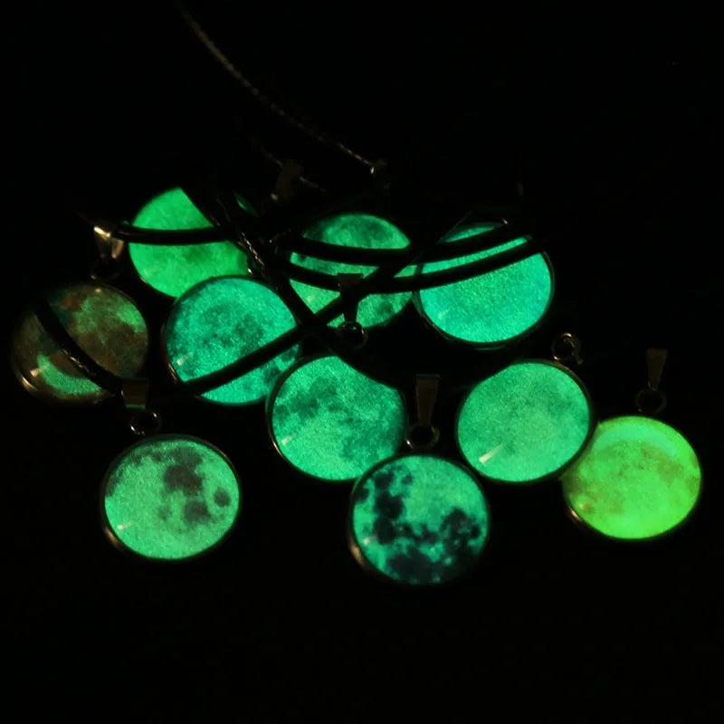 Close-up of a luminous constellation model glass pendant on an alloy necklace chain with extension.