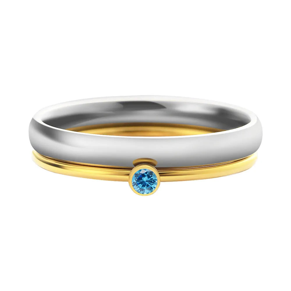 Geometric titanium steel ring with December colour birthstone and superimposed engraving.