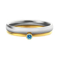 Geometric titanium steel ring with December colour birthstone and superimposed engraving.