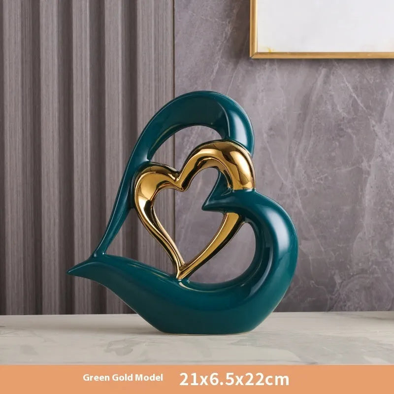 Modern white porcelain heart-shaped geometric ornament in a metallic gold finish.