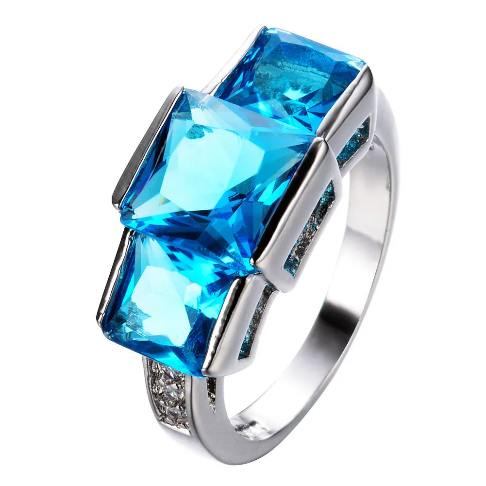 Copper ring ornament with geometric design in various colours including apple green, champagne and royal blue