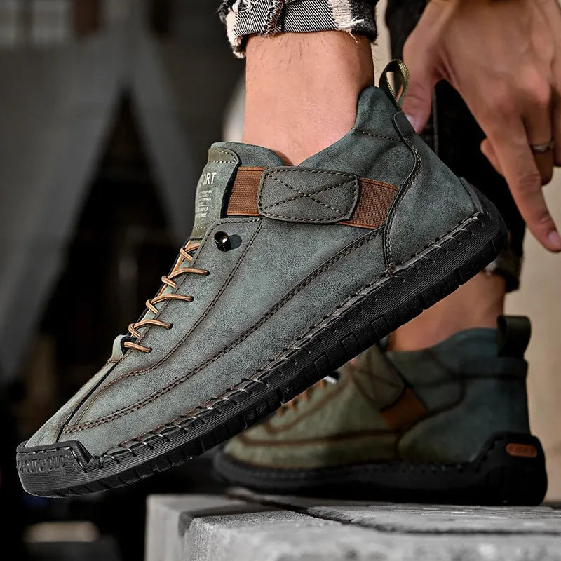 Men's mid-calf martin boots in khaki with visible tooling stitching and an elastic band closure.