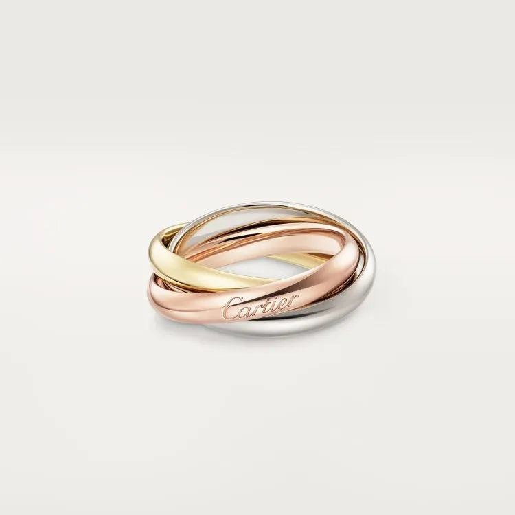 Three stackable geometric U-shaped sterling silver couple rings on a finger, showing gold rose silver finish.