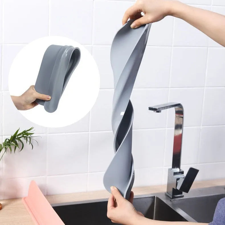 A thick gray blue black silicone kitchen sink splash guard measuring 52mm by 85mm.