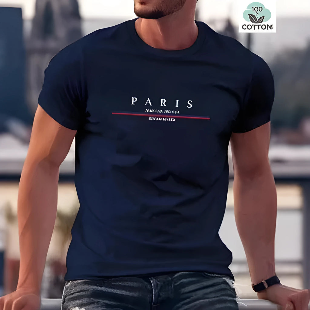 Man wearing a loose-fit short-sleeved t-shirt with a large letter print on the chest in a solid colour.