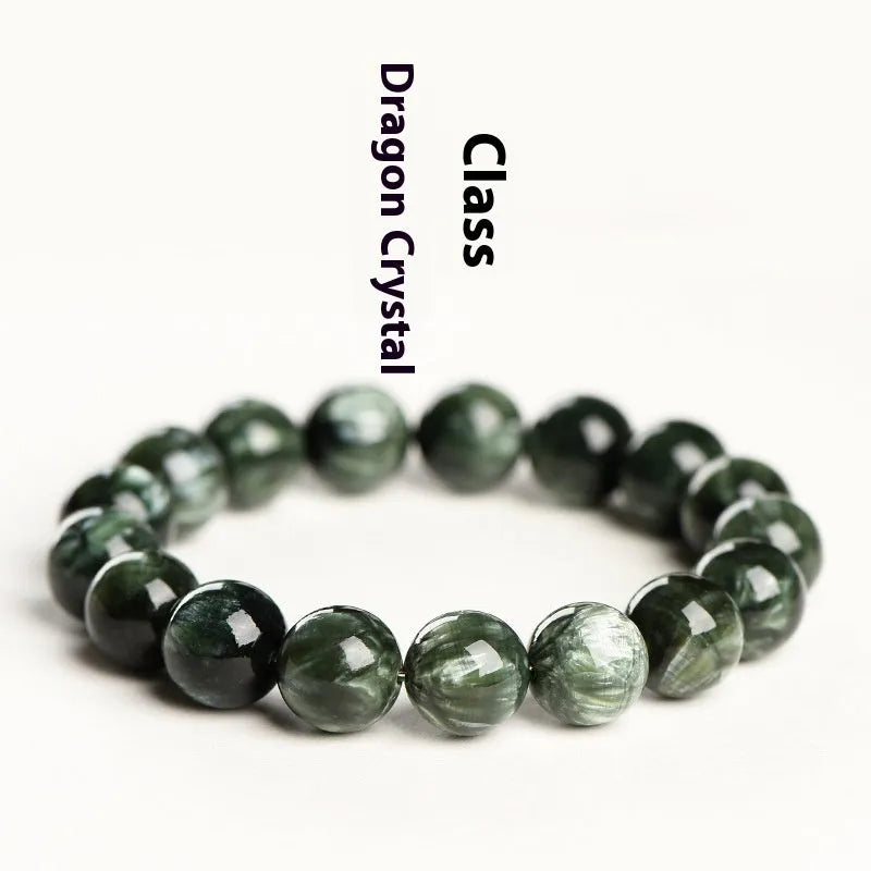 Natural green dragon crystal bracelet with 8-9mm round beads and Ruyi design on wrist.