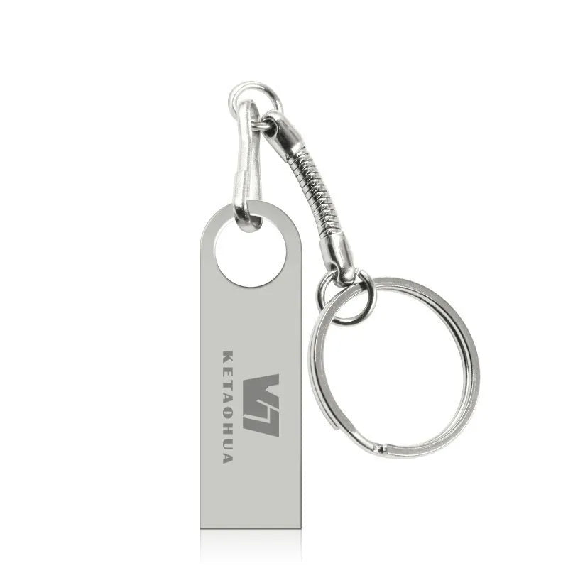 Metal car-shaped USB flash drive in silver, gold, rose gold, or black, showing compact size and USB connector.