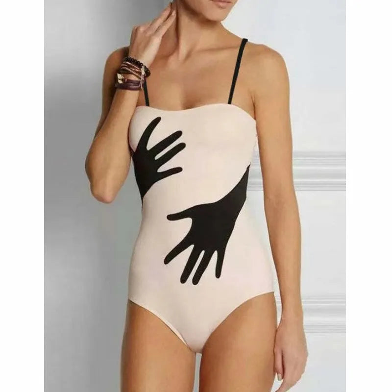 Women's one-piece swimsuit bikini with a sheer gauze skirt overlay.