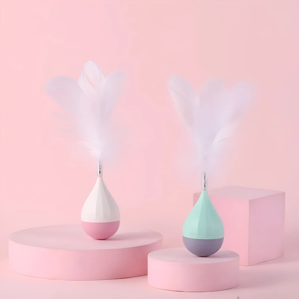 Green and pink feather tumbler cat toy with aluminium alloy frame and self-healing design