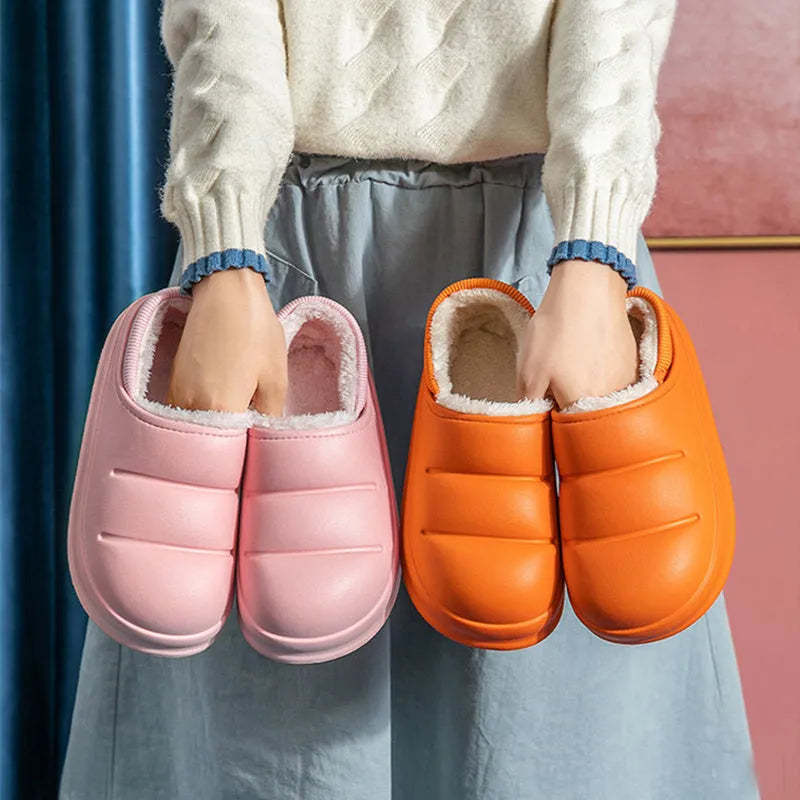 Waterproof EVA couple slippers in various colours showing hollow design and flat non-slip sole.